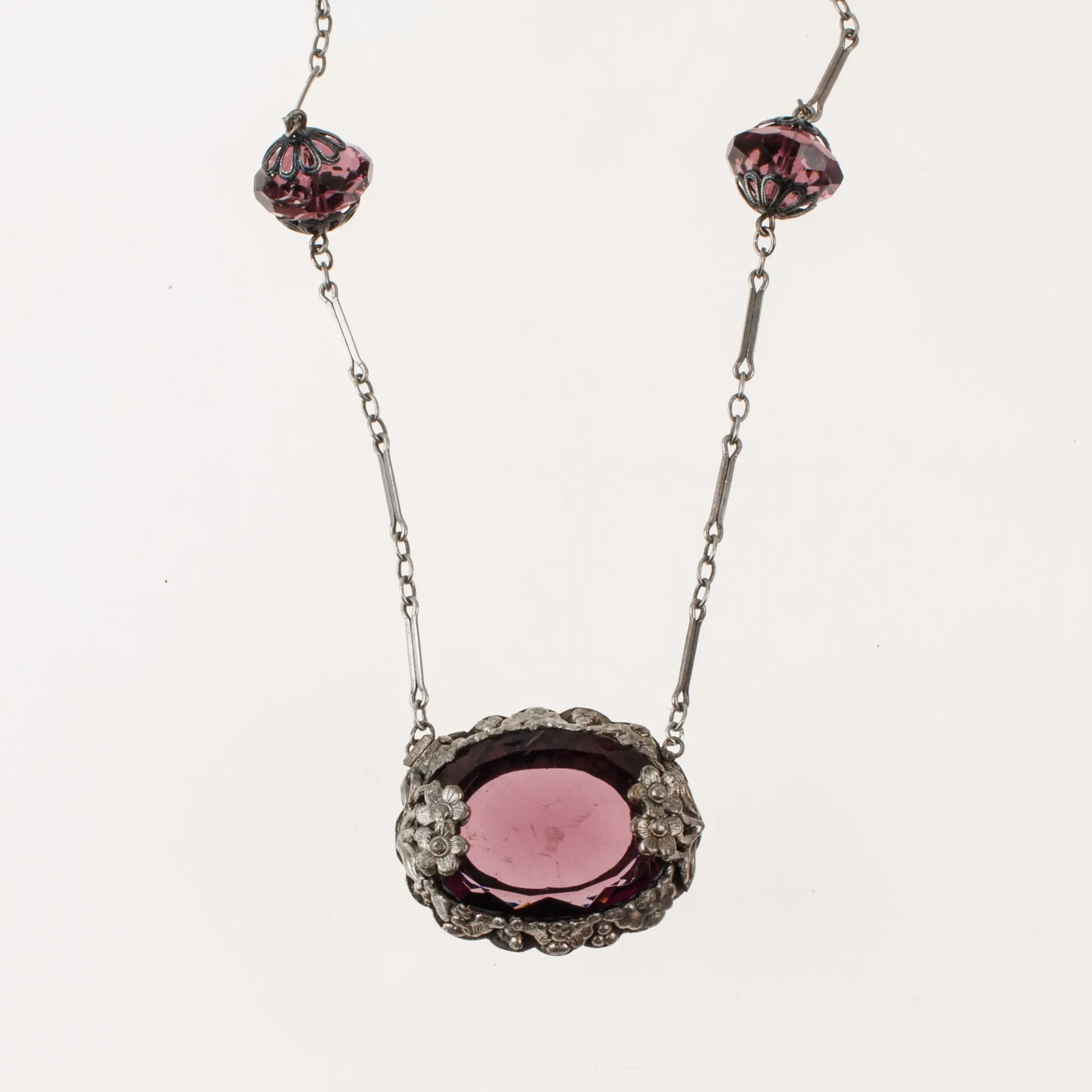Art Deco pendant necklace, amethyst glass with floral bezel j-NLAD991